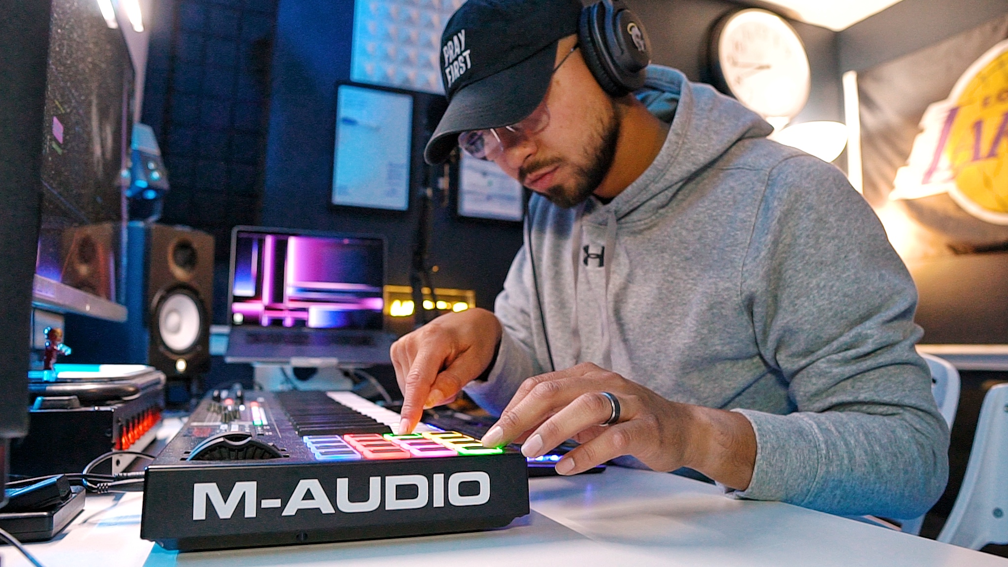 Rmcbeatz making music at his studio keyboard